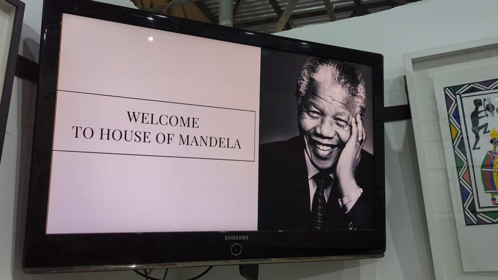Photo of the sign in South Africa that says Welcome to the House of Mandela